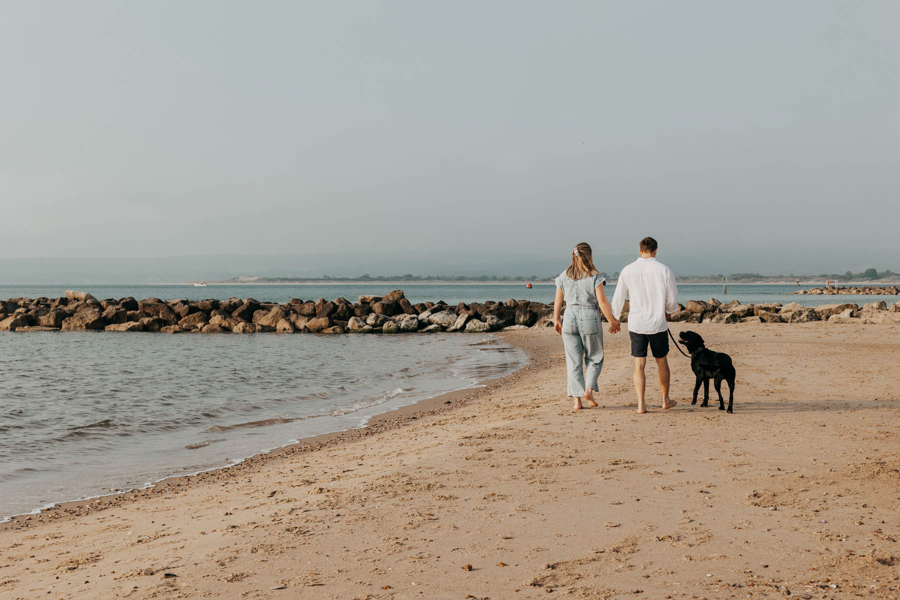 Izzie, The South Coast Concierge, walking on the beach in Dorset